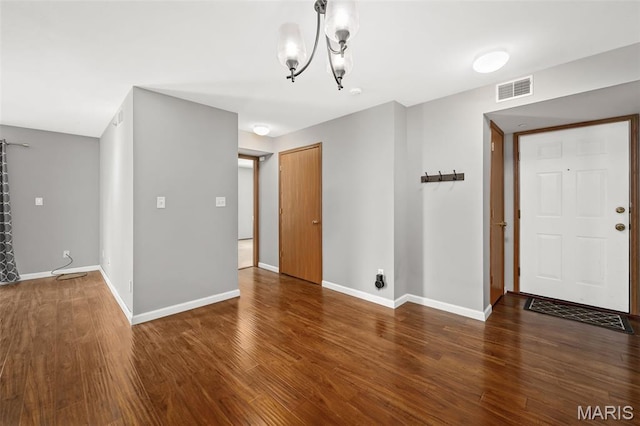 1141 Arbor Creek Dr Unit 2C, Saint Louis, MO 63122 - spare room with wood finished floors and a chandelier