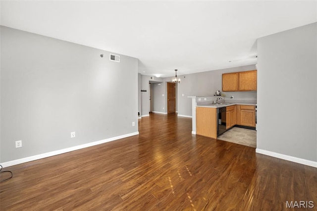 1141 Arbor Creek Dr Unit 2C, Saint Louis, MO 63122 - unfurnished living room featuring a chandelier and wood finished floors