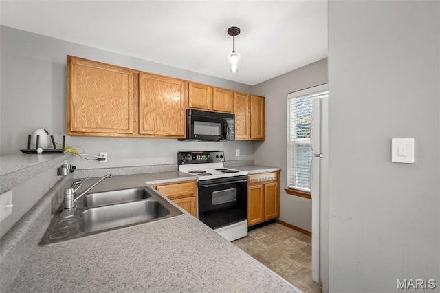 1141 Arbor Creek Dr Unit 2C, Saint Louis, MO 63122 - kitchen with electric stove, black microwave, freestanding refrigerator, light countertops, and pendant lighting