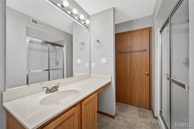 1141 Arbor Creek Dr Unit 2C, Saint Louis, MO 63122 - full bath featuring a shower stall, vanity, and stone finish floors