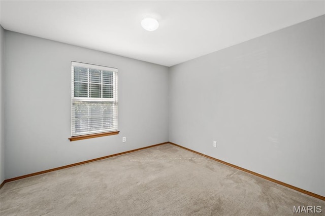 1141 Arbor Creek Dr Unit 2C, Saint Louis, MO 63122 - spare room featuring baseboards and carpet