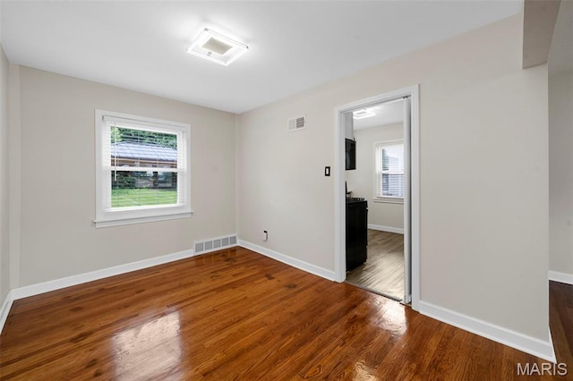 841 N Geyer Rd, Kirkwood, MO 63122 - unfurnished room featuring plenty of natural light and wood finished floors
