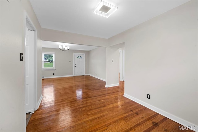 841 N Geyer Rd, Kirkwood, MO 63122 - unfurnished room with a chandelier and wood finished floors
