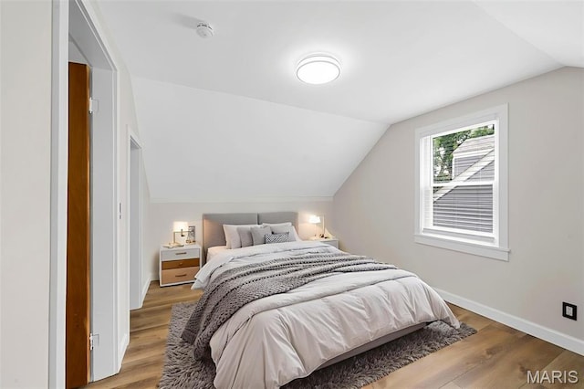 841 N Geyer Rd, Kirkwood, MO 63122 - bedroom with lofted ceiling and light wood-style floors