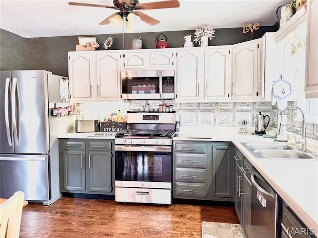 18 Sandstone Ct, Troy, IL 62294 - kitchen with stainless steel appliances, gray cabinets, a ceiling fan, light countertops, and tasteful backsplash