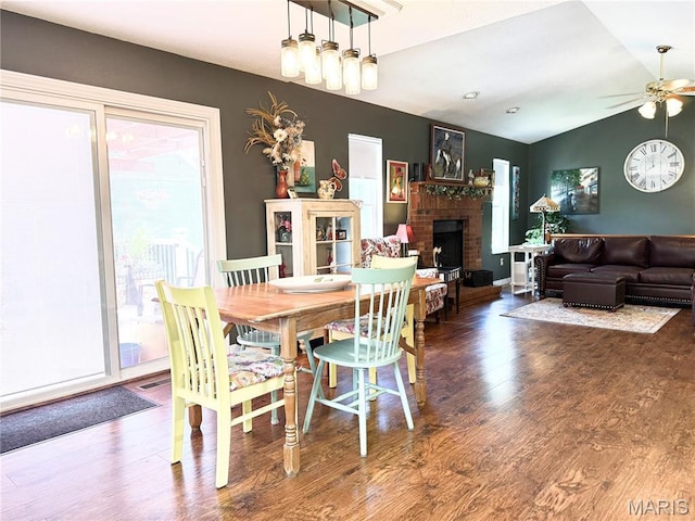 18 Sandstone Ct, Troy, IL 62294 - dining room featuring healthy amount of natural light, a fireplace, wood finished floors, and a ceiling fan
