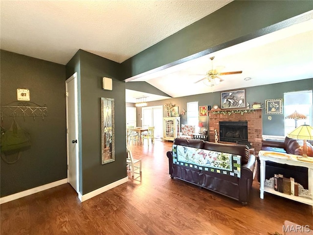 18 Sandstone Ct, Troy, IL 62294 - living area featuring wood finished floors, ceiling fan, lofted ceiling, and a brick fireplace