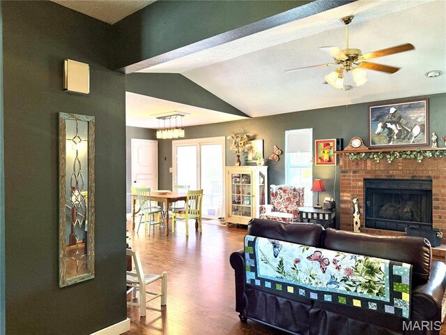 18 Sandstone Ct, Troy, IL 62294 - living area featuring wood finished floors, lofted ceiling, a brick fireplace, and ceiling fan