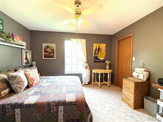 18 Sandstone Ct, Troy, IL 62294 - bedroom featuring light carpet, a textured ceiling, and a ceiling fan