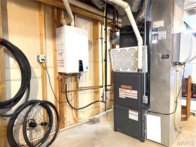 18 Sandstone Ct, Troy, IL 62294 - utility room featuring water heater and heating unit