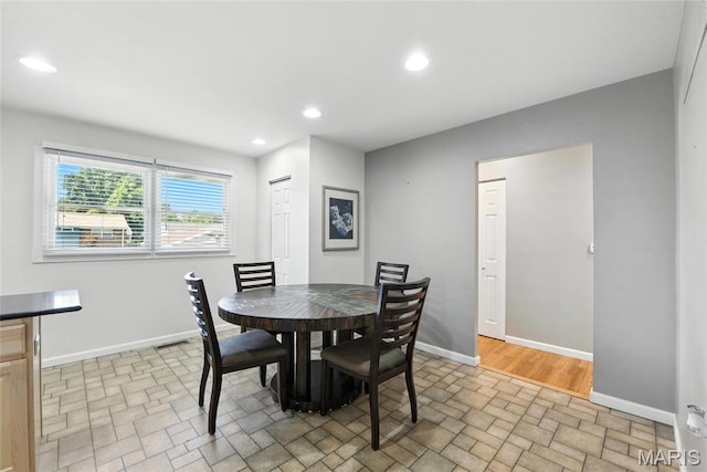 3205 Fleet Ln, Saint Charles, MO 63301 - dining space with brick patterned flooring and recessed lighting