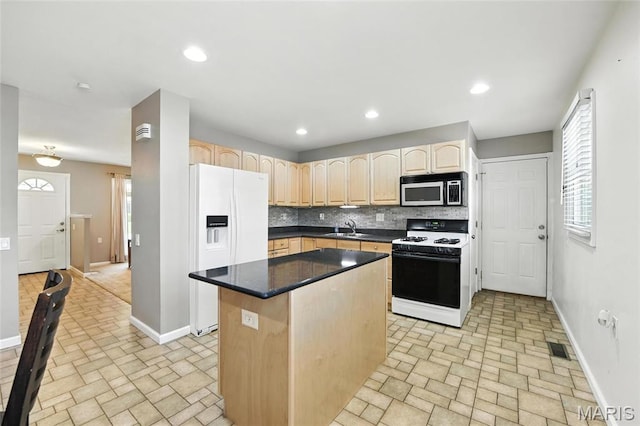 3205 Fleet Ln, Saint Charles, MO 63301 - kitchen featuring white appliances, brick patterned flooring, light brown cabinetry, tasteful backsplash, and recessed lighting