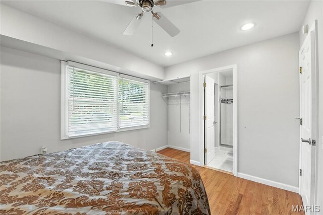 3205 Fleet Ln, Saint Charles, MO 63301 - unfurnished bedroom featuring wood finished floors, recessed lighting, a closet, ceiling fan, and a walk in closet