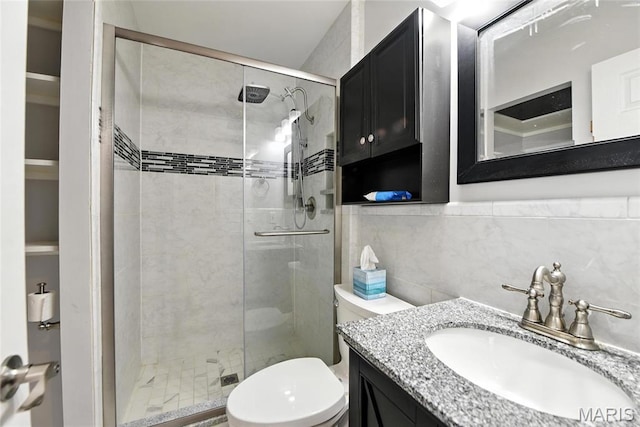 3205 Fleet Ln, Saint Charles, MO 63301 - bathroom featuring vanity, a stall shower, and tile walls