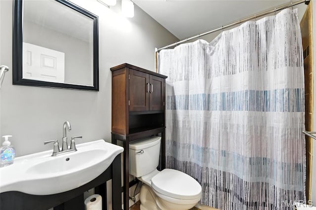3205 Fleet Ln, Saint Charles, MO 63301 - bathroom featuring toilet and a shower with curtain