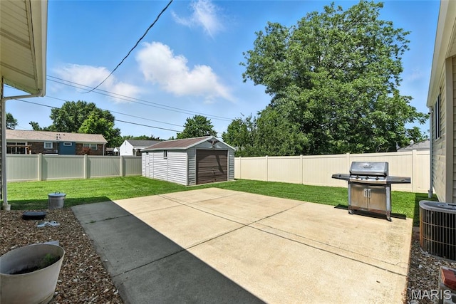 3205 Fleet Ln, Saint Charles, MO 63301 - fenced backyard with a grill, a patio, and an outbuilding