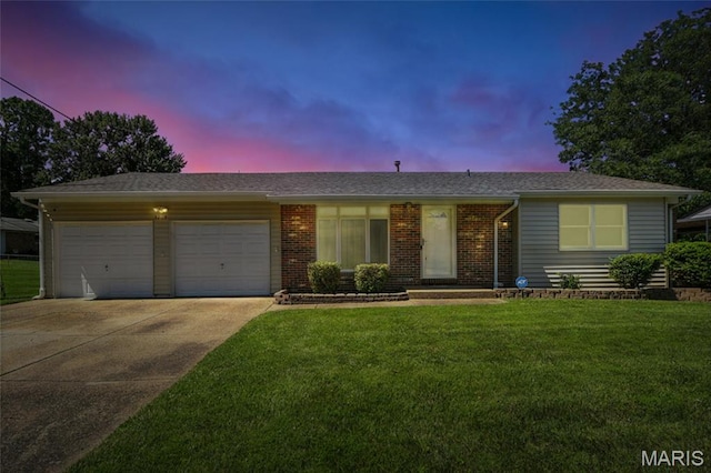 3205 Fleet Ln, Saint Charles, MO 63301 - ranch-style home with an attached garage, driveway, a front lawn, and brick siding