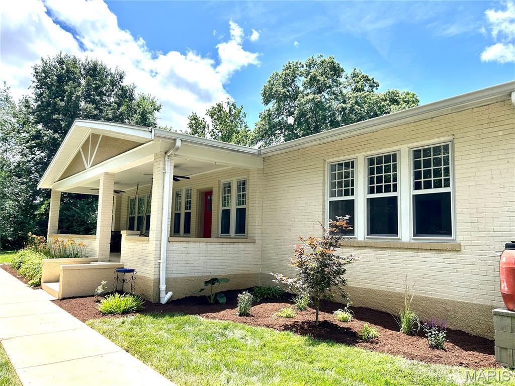 471 Toft Ln, Webster Groves, MO 63119 - view of front of property with brick siding and covered porch