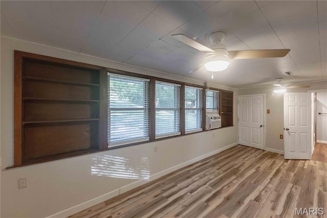 656 Sunset Farms Trl, Union, MO 63084 - unfurnished room with wood finished floors, a ceiling fan, cooling unit, and built in shelves