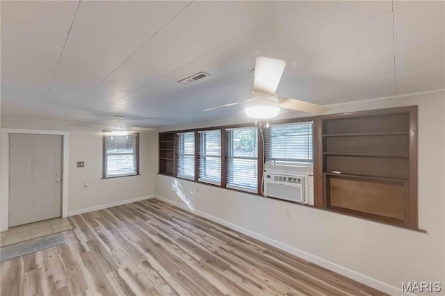 656 Sunset Farms Trl, Union, MO 63084 - empty room with light wood finished floors, cooling unit, and ceiling fan