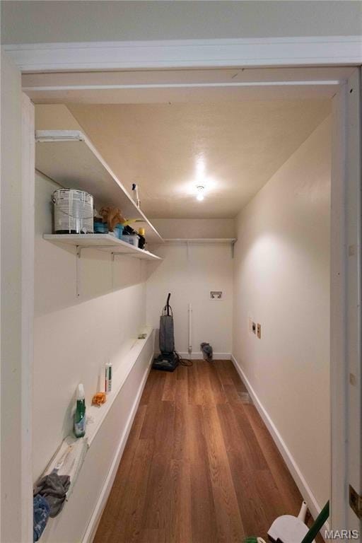 656 Sunset Farms Trl, Union, MO 63084 - laundry room with wood finished floors and baseboards