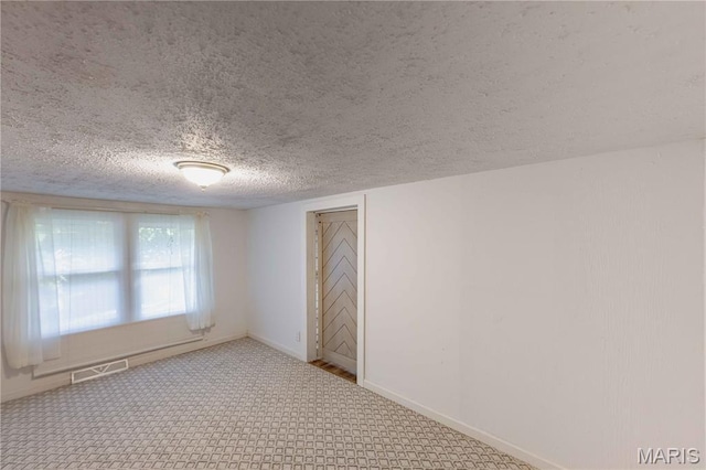 656 Sunset Farms Trl, Union, MO 63084 - carpeted empty room featuring a textured ceiling and baseboards