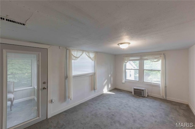 656 Sunset Farms Trl, Union, MO 63084 - carpeted spare room with a wall mounted air conditioner and a textured ceiling