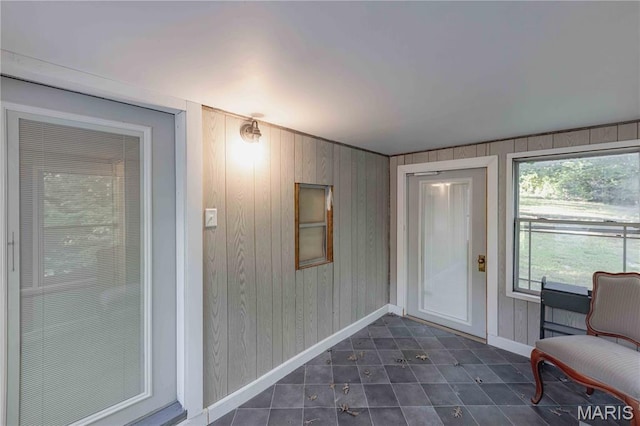 656 Sunset Farms Trl, Union, MO 63084 - doorway featuring wooden walls and dark tile patterned flooring