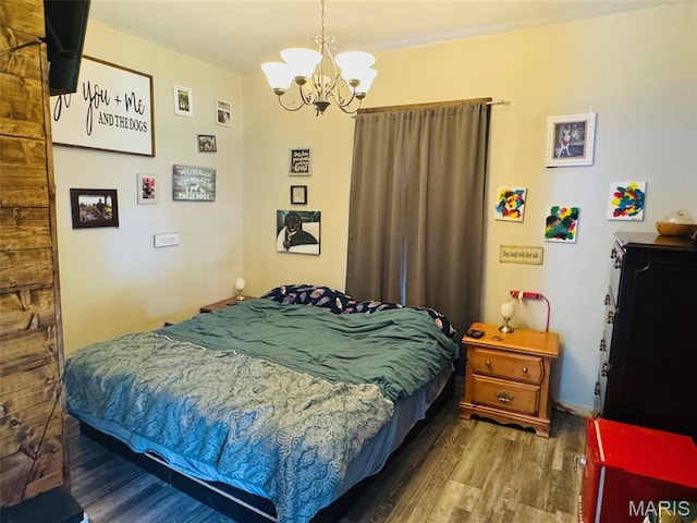 1516 W Main St, Vandalia, IL 62471 - bedroom with a chandelier and wood finished floors