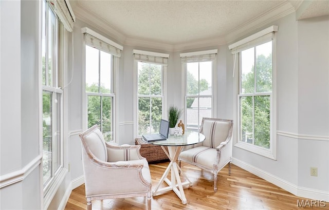 3432 Civic Green Dr, Saint Charles, MO 63301 - sunroom / solarium with wood finished floors, ornamental molding, and a textured ceiling