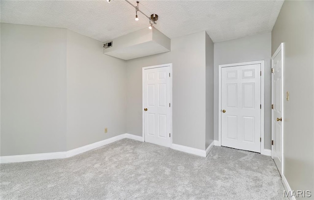 3432 Civic Green Dr, Saint Charles, MO 63301 - unfurnished bedroom featuring carpet and a textured ceiling