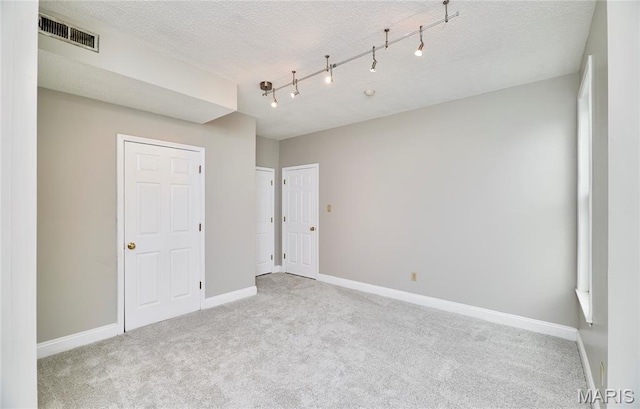 3432 Civic Green Dr, Saint Charles, MO 63301 - spare room featuring carpet floors and a textured ceiling