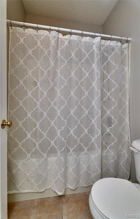 3432 Civic Green Dr, Saint Charles, MO 63301 - full bathroom with a textured ceiling, a shower with shower curtain, and tile patterned flooring