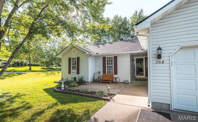 708 Chestnut Dr, Rolla, MO 65401 - rear view of property with a lawn and roof with shingles