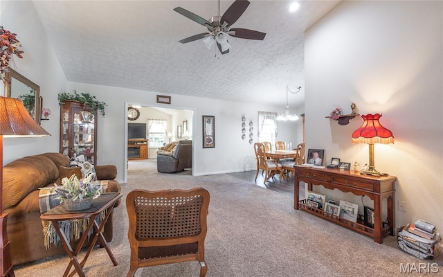 708 Chestnut Dr, Rolla, MO 65401 - carpeted living area with ceiling fan, a textured ceiling, lofted ceiling, and a chandelier