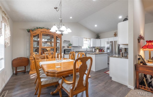 708 Chestnut Dr, Rolla, MO 65401 - dining room featuring a chandelier, lofted ceiling, dark wood-style floors, and recessed lighting
