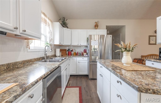 708 Chestnut Dr, Rolla, MO 65401 - kitchen with stainless steel appliances, white cabinetry, dark wood-style floors, backsplash, and a textured ceiling