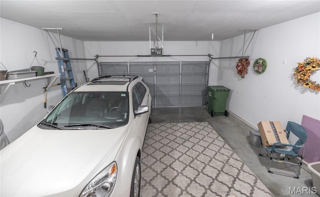 708 Chestnut Dr, Rolla, MO 65401 - garage featuring a garage door opener