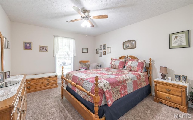 708 Chestnut Dr, Rolla, MO 65401 - carpeted bedroom featuring a textured ceiling and ceiling fan