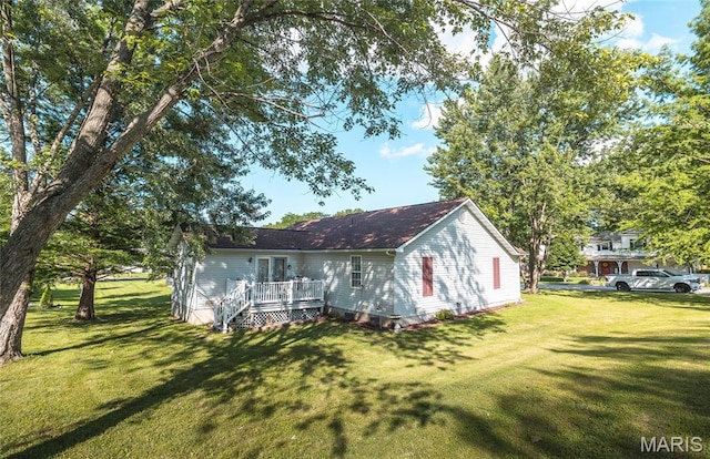 708 Chestnut Dr, Rolla, MO 65401 - back of house featuring a yard and a wooden deck
