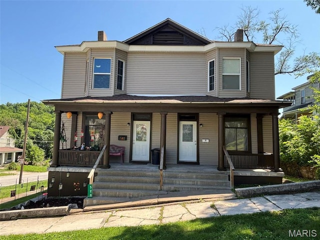 518 N 5th St Unit 518-520, Hannibal, MO 63401 - view of front of home featuring a chimney and covered porch