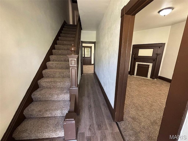 518 N 5th St Unit 518-520, Hannibal, MO 63401 - staircase featuring a fireplace and wood finished floors