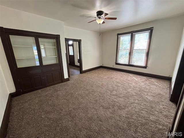 518 N 5th St Unit 518-520, Hannibal, MO 63401 - carpeted empty room with a ceiling fan and baseboards