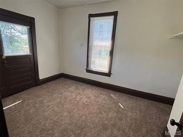 518 N 5th St Unit 518-520, Hannibal, MO 63401 - carpeted empty room with baseboards
