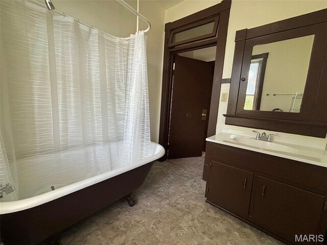 518 N 5th St Unit 518-520, Hannibal, MO 63401 - bathroom featuring vanity, tile patterned floors, and a combined bath / shower with freestanding tub