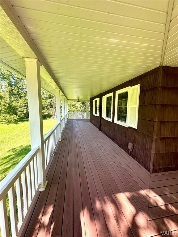 701 Alvarado, Belle, MO 65013 - wooden porch featuring a yard
