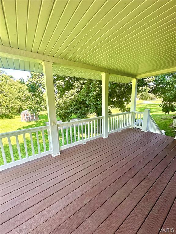 701 Alvarado, Belle, MO 65013 - wooden porch with a yard