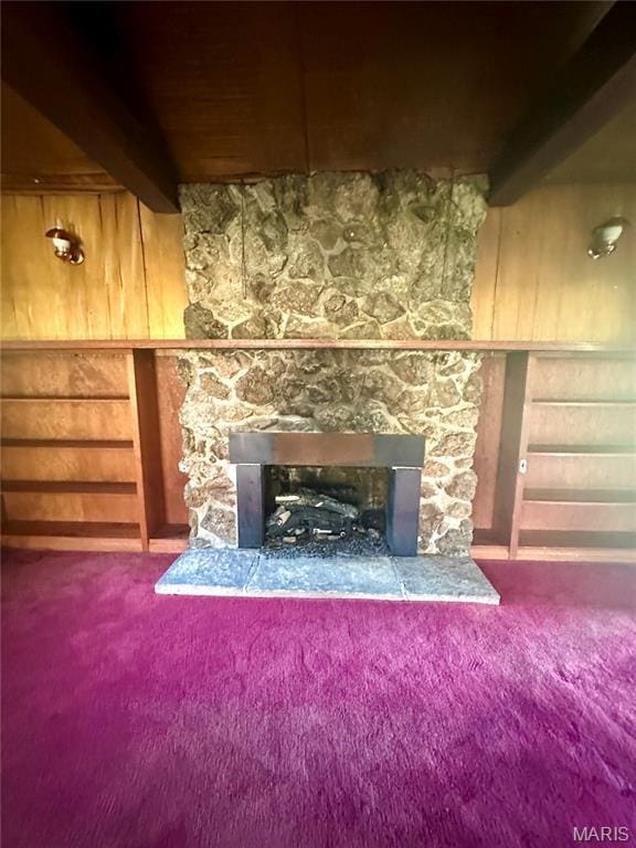 701 Alvarado, Belle, MO 65013 - detailed view of a fireplace, carpet, and beamed ceiling