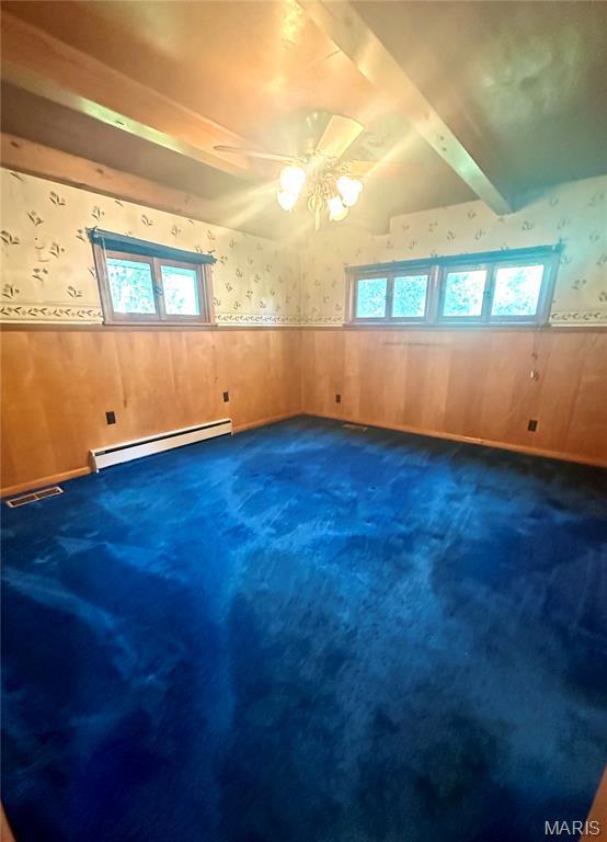 701 Alvarado, Belle, MO 65013 - spare room featuring wallpapered walls, a wainscoted wall, baseboard heating, carpet, and a ceiling fan