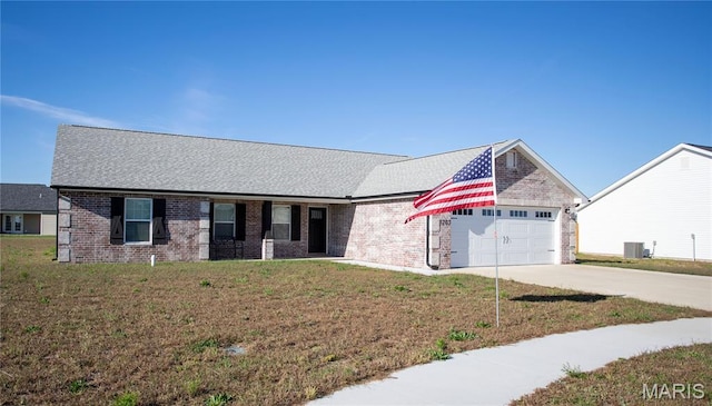 1205 Yosemite, Sikeston, MO 63801 - ranch-style home featuring an attached garage, concrete driveway, a front lawn, and brick siding